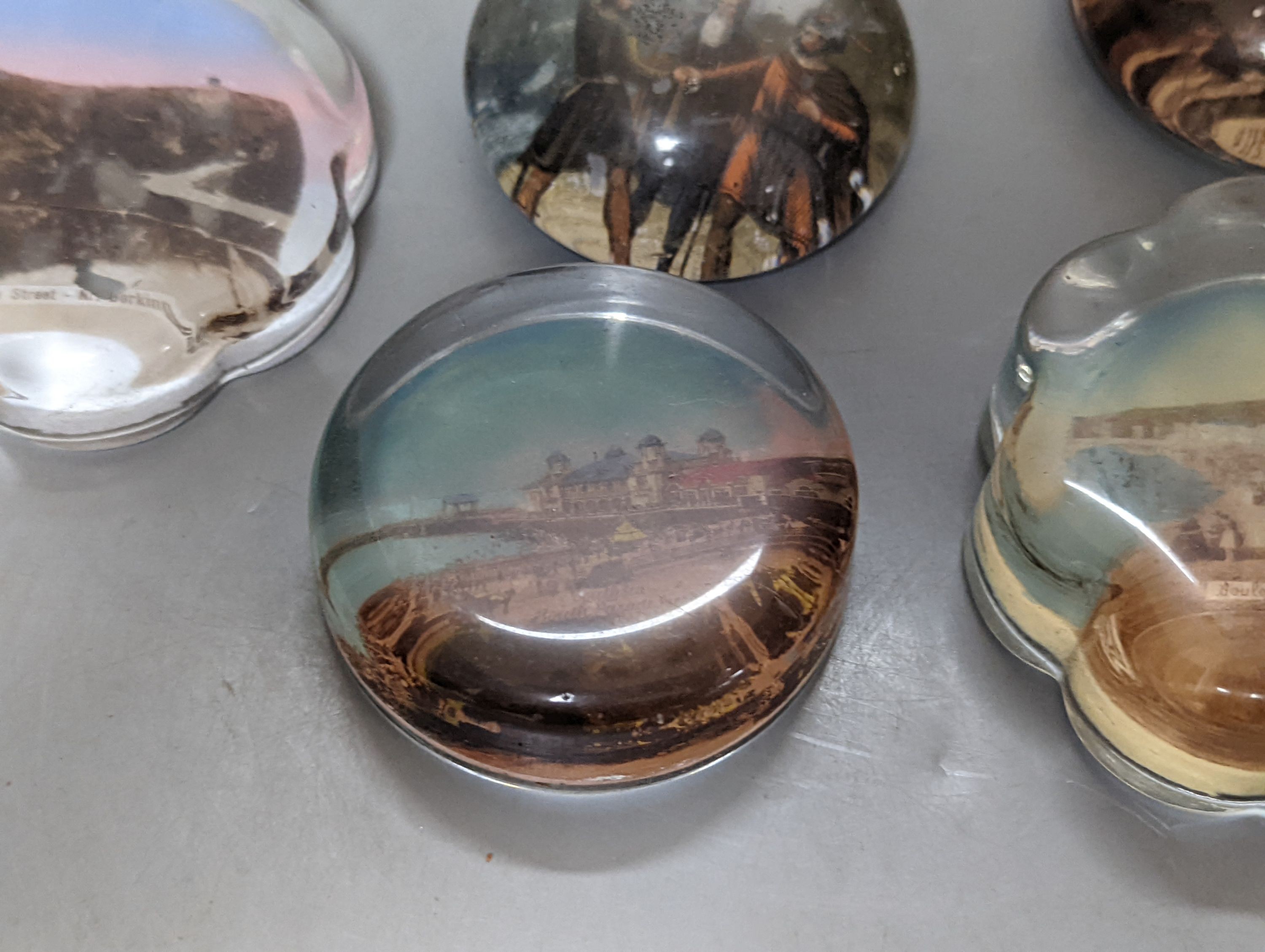 Nine various glass paperweights